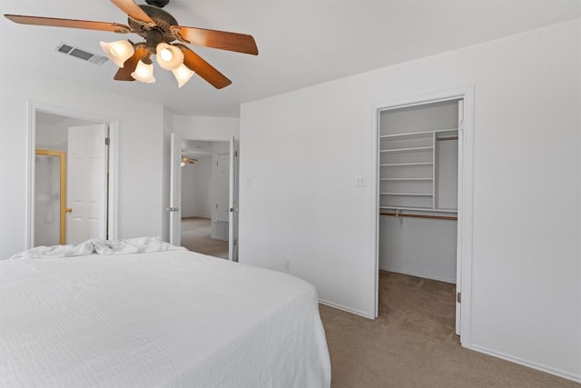 14708 Single Trce, Austin, TX 78728 - bedroom with a spacious closet, carpet flooring, a closet, a ceiling fan, and baseboards