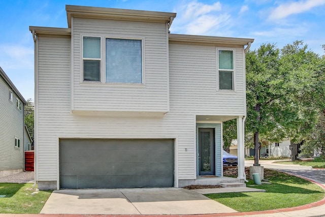 3001 Del Curto Rd Unit 11, Austin, TX 78704 - view of front of home featuring an attached garage and concrete driveway