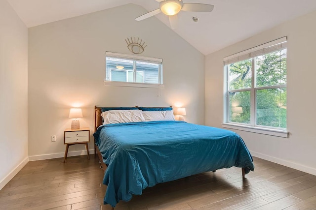 3001 Del Curto Rd Unit 11, Austin, TX 78704 - bedroom with wood-type flooring, multiple windows, vaulted ceiling, baseboards, and a ceiling fan