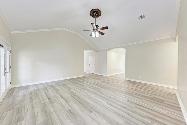 903 N Neans Dr, Austin, TX 78758 - unfurnished living room featuring a ceiling fan, arched walkways, light wood finished floors, crown molding, and vaulted ceiling
