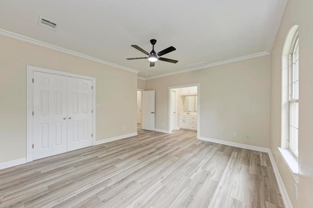903 N Neans Dr, Austin, TX 78758 - unfurnished bedroom featuring light wood-type flooring, a closet, ornamental molding, ceiling fan, and ensuite bath