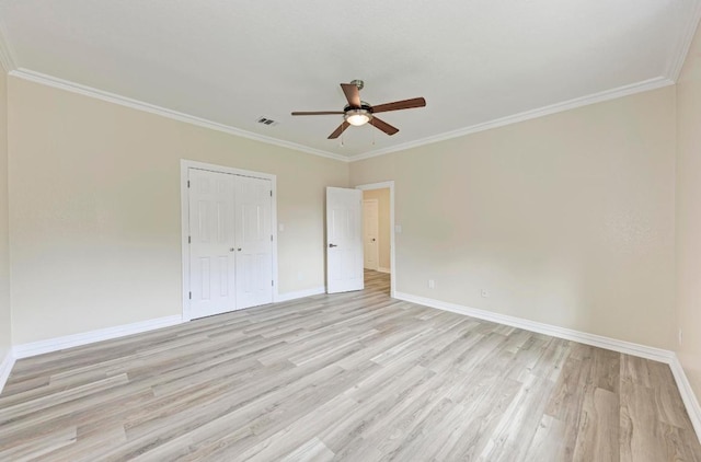 903 N Neans Dr, Austin, TX 78758 - spare room featuring a ceiling fan, light wood-type flooring, baseboards, and ornamental molding