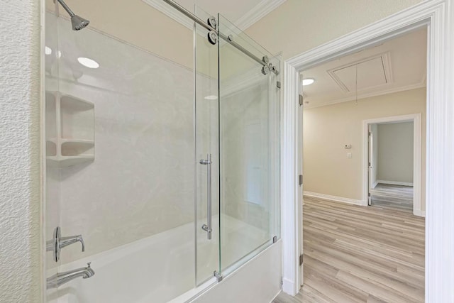 903 N Neans Dr, Austin, TX 78758 - bathroom featuring ornamental molding, shower / bath combination with glass door, wood finished floors, and baseboards