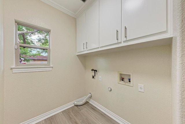 903 N Neans Dr, Austin, TX 78758 - washroom with cabinet space, baseboards, crown molding, light wood finished floors, and hookup for a washing machine