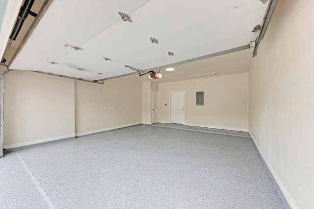 903 N Neans Dr, Austin, TX 78758 - garage with a garage door opener, electric panel, and baseboards