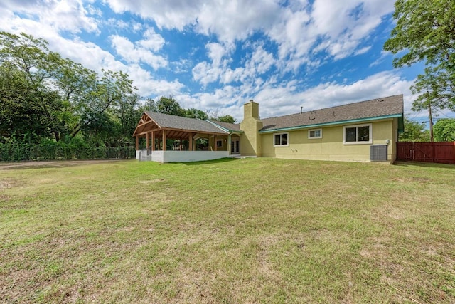 903 N Neans Dr, Austin, TX 78758 - rear view of house with a chimney and stucco siding