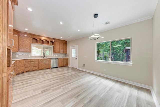 903 N Neans Dr, Austin, TX 78758 - kitchen featuring light countertops, dishwasher, tasteful backsplash, recessed lighting, and crown molding