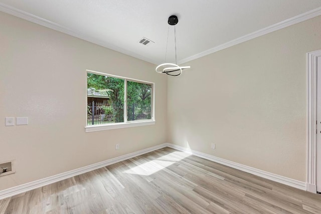 903 N Neans Dr, Austin, TX 78758 - spare room featuring light wood-style floors and ornamental molding