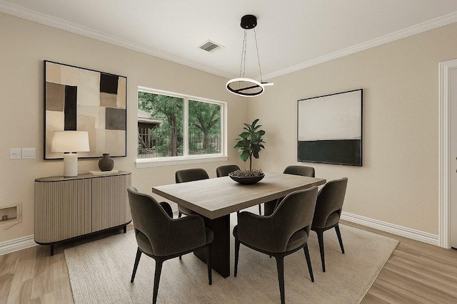 903 N Neans Dr, Austin, TX 78758 - dining space with light wood finished floors and ornamental molding