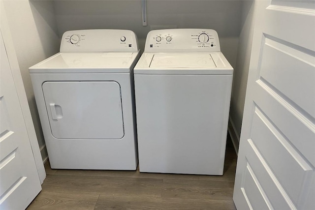 2220 Webberville Rd Unit 204, Austin, TX 78702 - laundry area with independent washer and dryer and dark wood finished floors