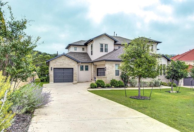 1916 Port Bari Ct, Leander, TX 78641 - view of front facade featuring stucco siding, stone siding, concrete driveway, a front yard, and roof with shingles