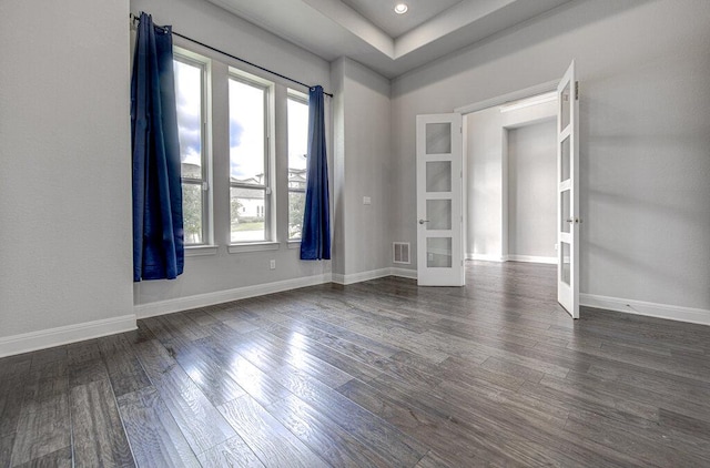 1916 Port Bari Ct, Leander, TX 78641 - empty room with french doors, plenty of natural light, dark wood-type flooring, and baseboards