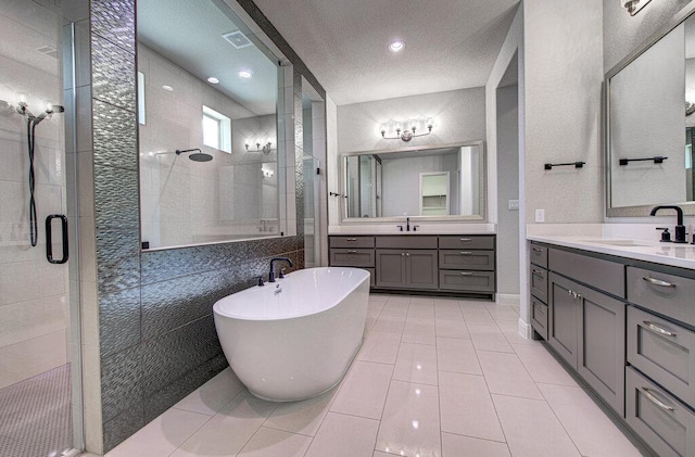 1916 Port Bari Ct, Leander, TX 78641 - full bathroom with a stall shower, two vanities, a freestanding bath, and tile patterned floors