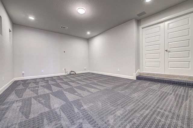 1916 Port Bari Ct, Leander, TX 78641 - below grade area featuring dark colored carpet, baseboards, and recessed lighting