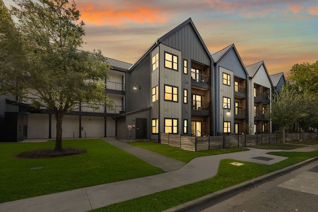 3101 Govalle Ave Unit 219, Austin, TX 78702 - townhome / multi-family property with board and batten siding, a standing seam roof, metal roof, a balcony, and an attached garage