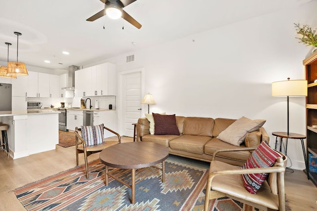 3101 Govalle Ave Unit 219, Austin, TX 78702 - living room featuring ceiling fan, light wood-type flooring, and recessed lighting