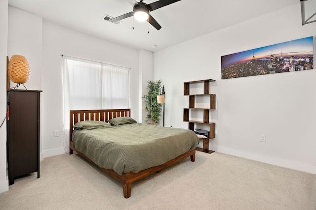 3101 Govalle Ave Unit 219, Austin, TX 78702 - bedroom with carpet flooring, baseboards, and a ceiling fan