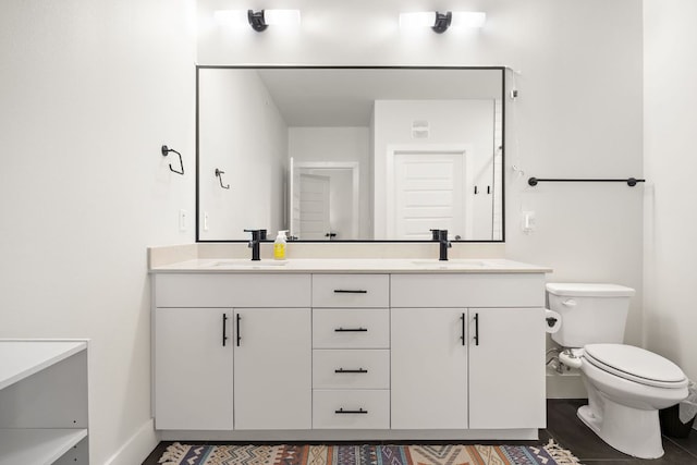 3101 Govalle Ave Unit 219, Austin, TX 78702 - full bath with double vanity, toilet, and baseboards