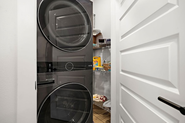 3101 Govalle Ave Unit 219, Austin, TX 78702 - laundry area with stacked washing machine and dryer and wood finished floors
