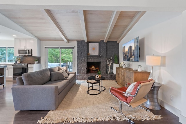 6610 Greensboro Dr, Austin, TX 78723 - living room featuring a large fireplace, wood finished floors, and wood ceiling