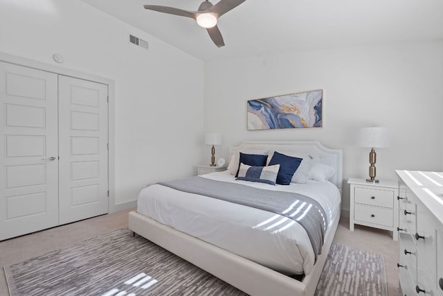6610 Greensboro Dr, Austin, TX 78723 - bedroom featuring light colored carpet, ceiling fan, and a closet