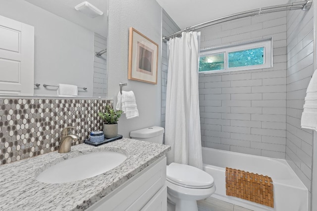 6610 Greensboro Dr, Austin, TX 78723 - bathroom with vanity, shower / bath combo with shower curtain, and backsplash