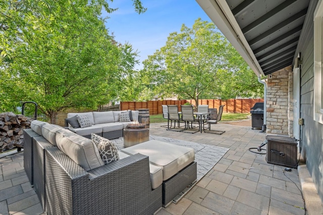 6610 Greensboro Dr, Austin, TX 78723 - fenced backyard with outdoor lounge area, outdoor dining space, a patio, and a grill