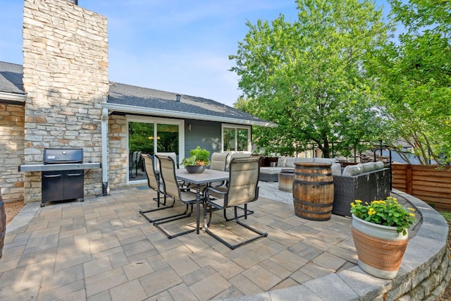 6610 Greensboro Dr, Austin, TX 78723 - view of patio featuring grilling area, outdoor dining space, and an outdoor living space with a fire pit