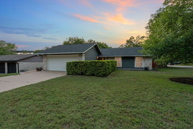 6610 Greensboro Dr, Austin, TX 78723 - ranch-style house featuring driveway, a garage, a front lawn, and stone siding