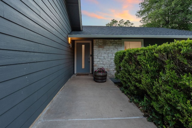 6610 Greensboro Dr, Austin, TX 78723 - doorway to property with stone siding