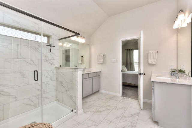 311 Westfield St, Hutto, TX 78634 - full bathroom with marble look tiles, vanity, a marble finish shower, ensuite bath, and vaulted ceiling