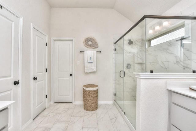 311 Westfield St, Hutto, TX 78634 - full bathroom featuring marble finish floors, vanity, a stall shower, and vaulted ceiling
