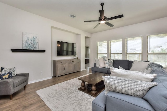 311 Westfield St, Hutto, TX 78634 - living area with wood finished floors and a ceiling fan