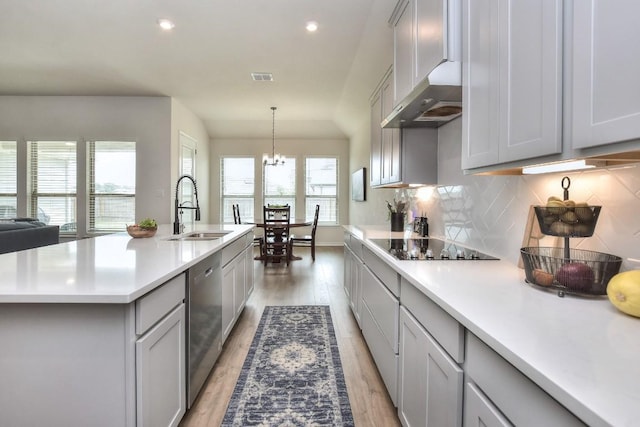 311 Westfield St, Hutto, TX 78634 - kitchen featuring ventilation hood, dishwasher, light wood-type flooring, light countertops, and recessed lighting
