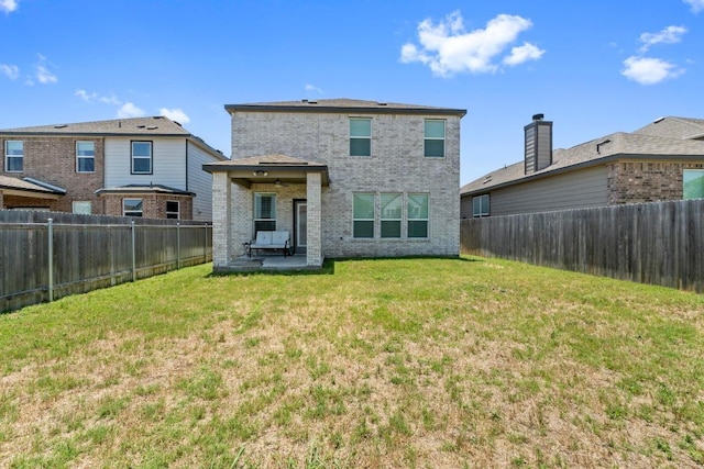 7212 Summer Tanager Dr Unit 28, Austin, TX 78744 - rear view of house with a patio area, a fenced backyard, and brick siding