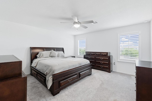 7212 Summer Tanager Dr Unit 28, Austin, TX 78744 - bedroom featuring multiple windows, light colored carpet, and ceiling fan