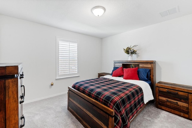 7212 Summer Tanager Dr Unit 28, Austin, TX 78744 - bedroom with carpet flooring and baseboards