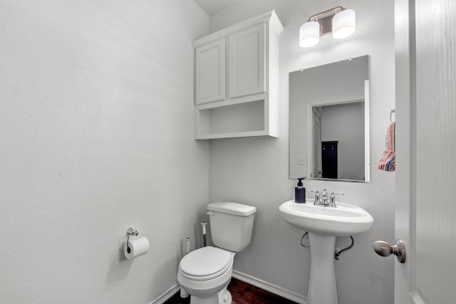 7212 Summer Tanager Dr Unit 28, Austin, TX 78744 - half bath featuring toilet and wood finished floors