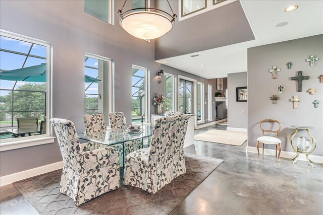14722 Beal Dr, Corpus Christi, TX 78410 - dining room featuring concrete floors, baseboards, and recessed lighting