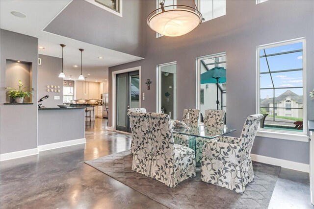 14722 Beal Dr, Corpus Christi, TX 78410 - dining space featuring finished concrete flooring and baseboards