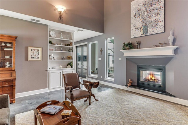 14722 Beal Dr, Corpus Christi, TX 78410 - living room with a glass covered fireplace, baseboards, and concrete floors