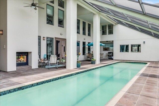 14722 Beal Dr, Corpus Christi, TX 78410 - outdoor pool featuring a patio area, a ceiling fan, and grilling area