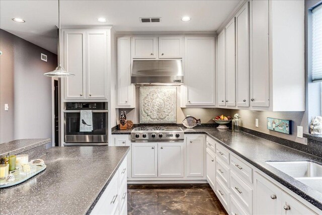 14722 Beal Dr, Corpus Christi, TX 78410 - kitchen featuring appliances with stainless steel finishes, under cabinet range hood, white cabinetry, and recessed lighting