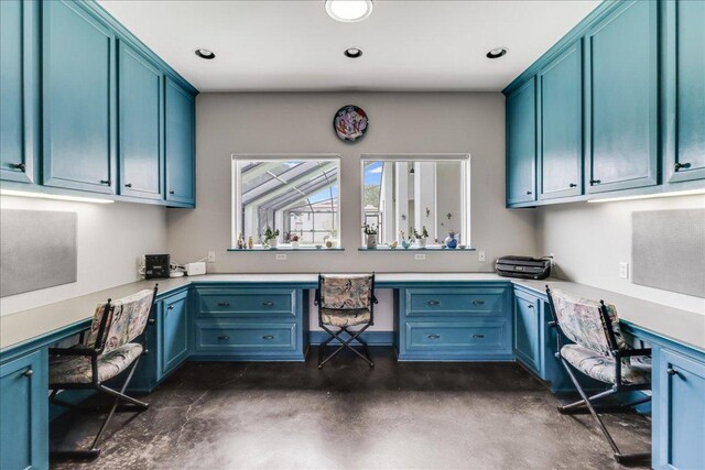 14722 Beal Dr, Corpus Christi, TX 78410 - home office featuring built in desk, concrete floors, and recessed lighting