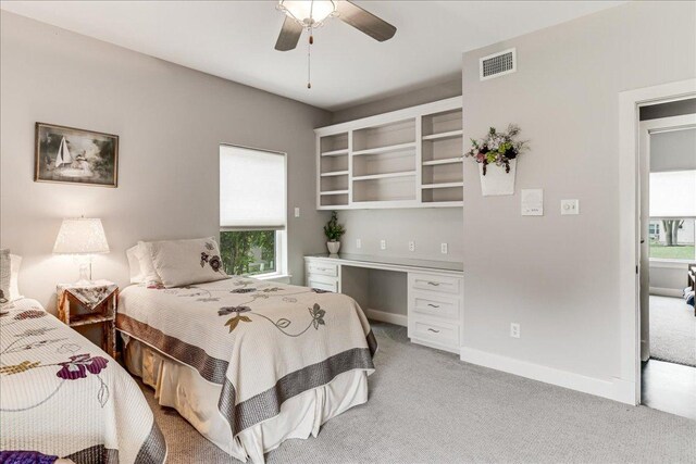 14722 Beal Dr, Corpus Christi, TX 78410 - bedroom with light colored carpet, a ceiling fan, a desk, and baseboards