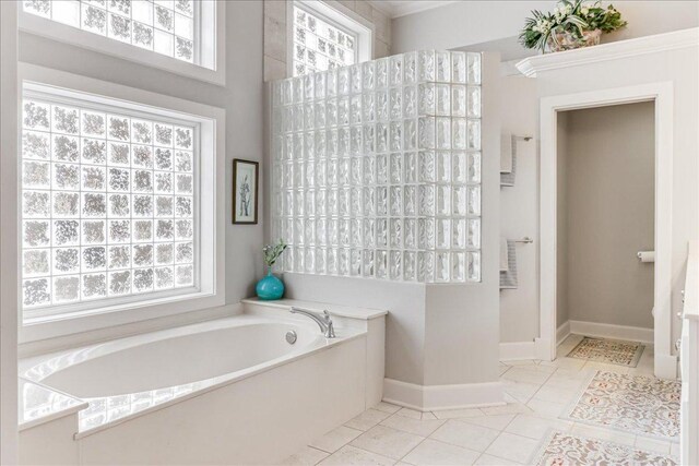 14722 Beal Dr, Corpus Christi, TX 78410 - full bathroom featuring a garden tub, baseboards, walk in shower, and tile patterned floors