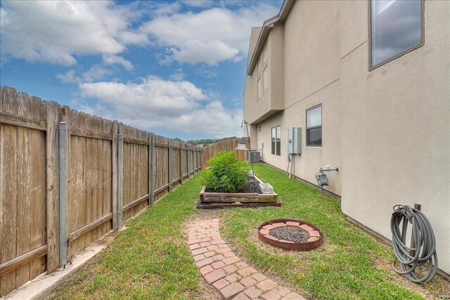 14722 Beal Dr, Corpus Christi, TX 78410 - view of yard featuring central air condition unit and a garden