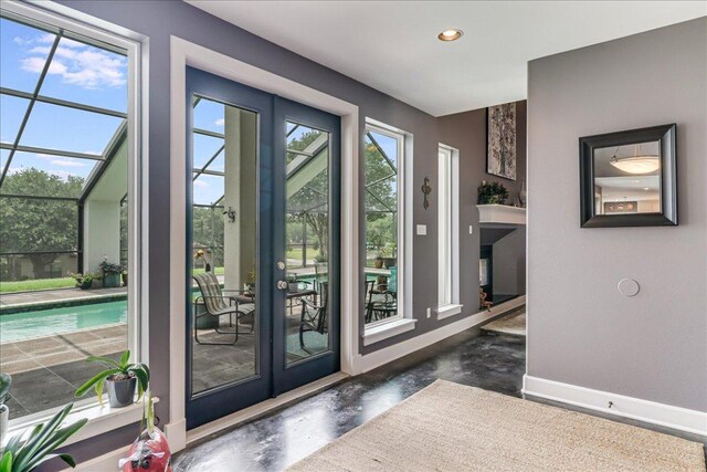 14722 Beal Dr, Corpus Christi, TX 78410 - doorway to outside featuring concrete floors, baseboards, and recessed lighting