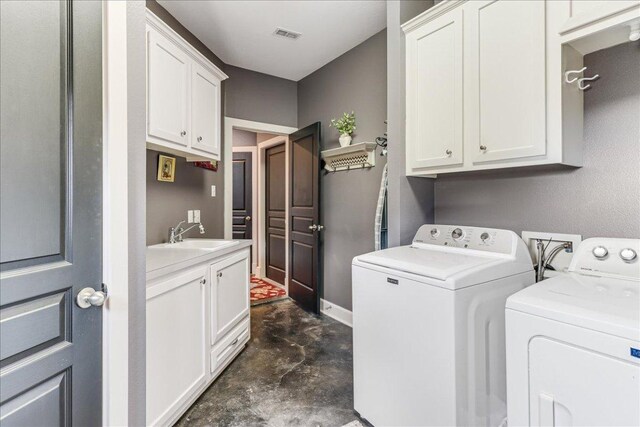 14722 Beal Dr, Corpus Christi, TX 78410 - laundry room featuring cabinet space, washer and dryer, and baseboards