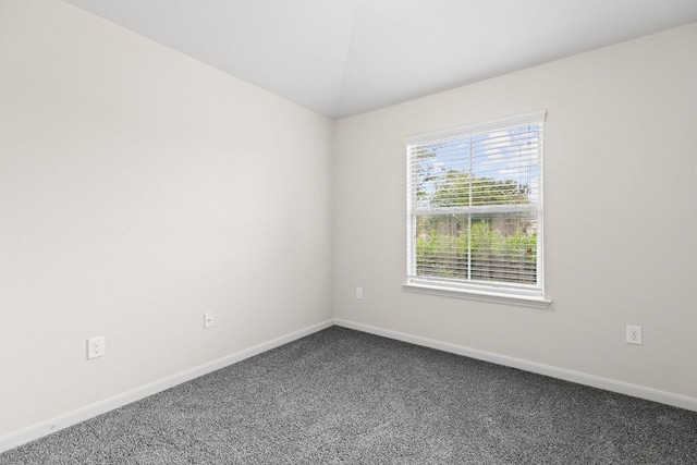 1105 Hawkeye Point Rd, Georgetown, TX 78626 - spare room featuring dark colored carpet and baseboards